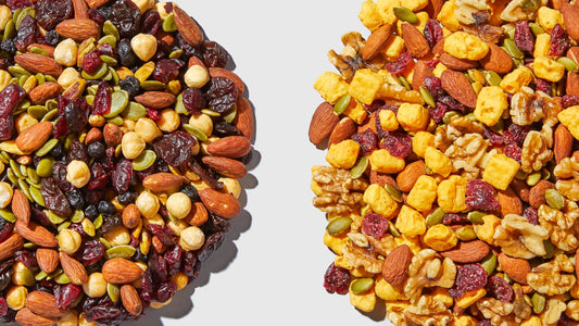 Homemade healthy trail mix with almonds, cashews, pumpkin seeds, probiotic tart cherries, and dark chocolate chips in a bowl—perfect for a nutritious snack.