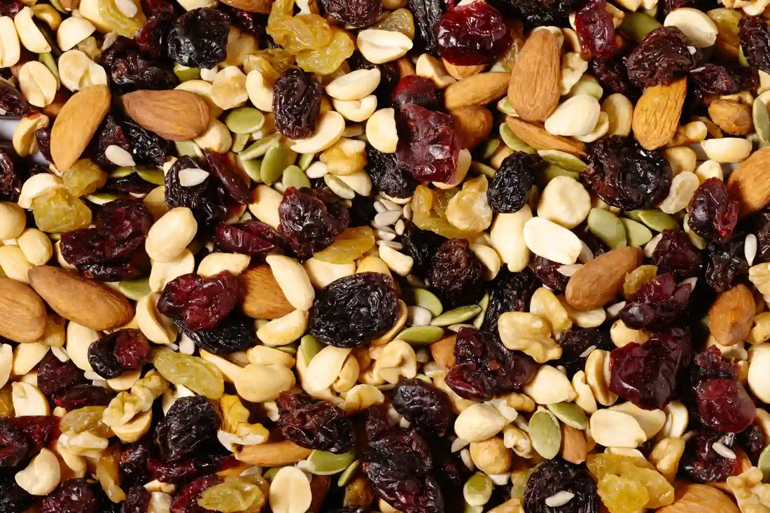 Dried cranberries mixed with nuts, seeds, and raisins in a colorful Nature’s Garden trail mix blend.