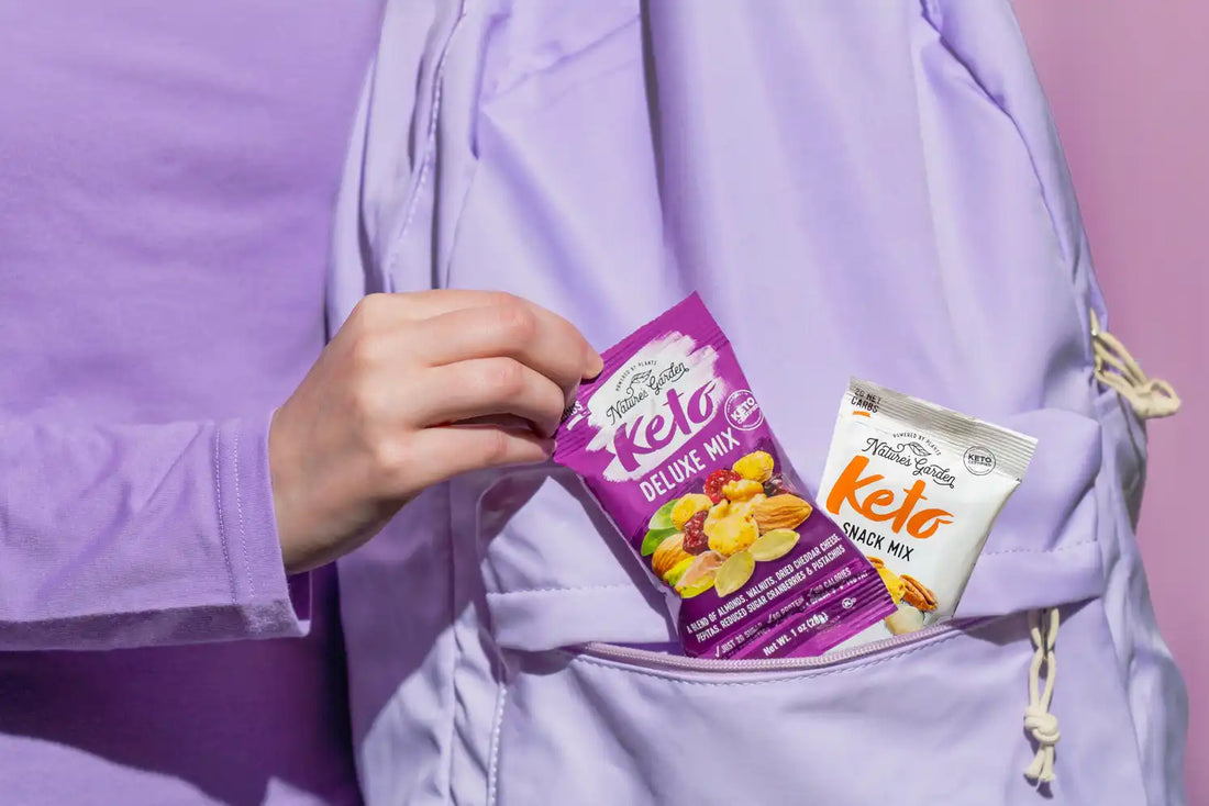 Nature’s Garden Keto trail mix snack packs in a backpack pocket, featuring low-carb nuts for keto and on-the-go snacking
