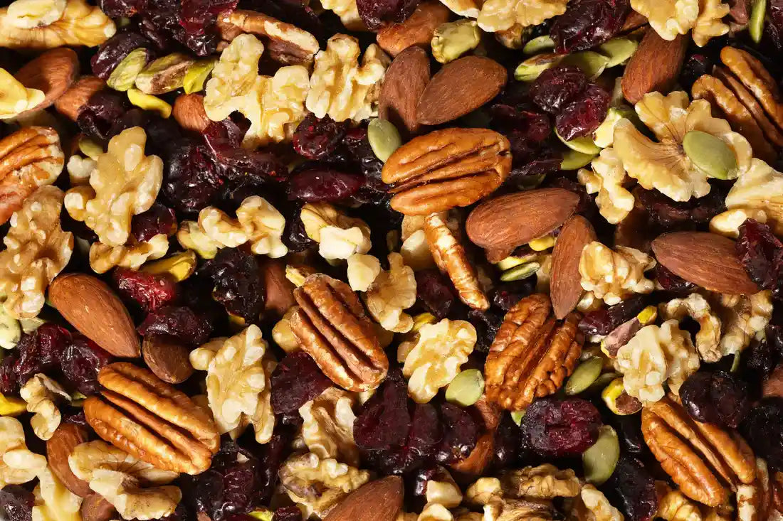 Close-up of Nature’s Garden Omega-3 Deluxe Mix featuring walnuts, pecans, almonds, dried cranberries, pistachios, and pumpkin seeds