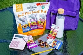 Nature’s Garden organic trail mix snack packs with backpack and water bottle