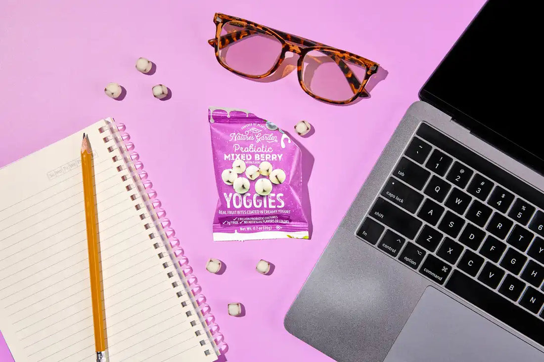 Nature’s Garden Probiotic Mixed Berry Yoggies snack pack on desk with laptop, notebook, and glasses in USA office setting.