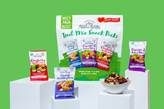 Nature’s Garden Heart Healthy Trail Mix Snack Packs multipack featuring cranberry, omega-3, and nut blends on green background.