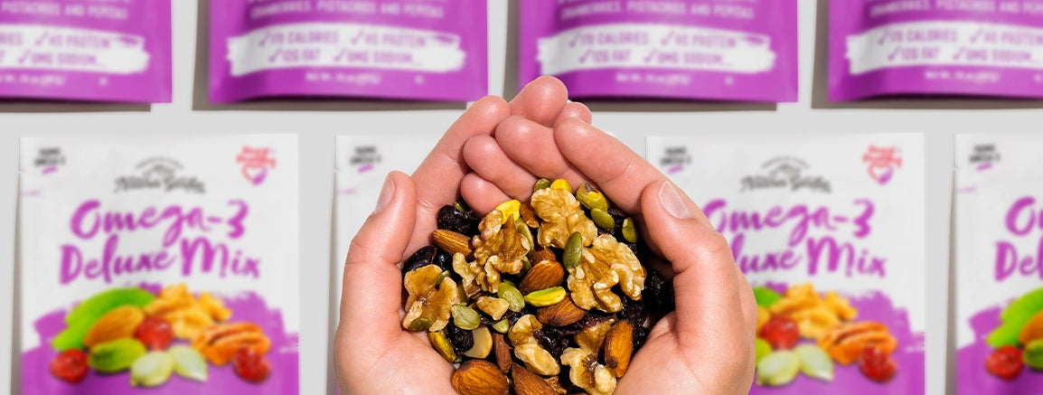 Ingredients in Omega-3 Deluxe Mix: walnuts, almonds, pepitas, pecans, pistachios, and cranberries, packed with omega-3 and antioxidants