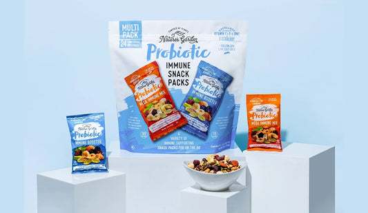 Nature’s Garden Probiotic Immune Snack Packs with 24-count mix of Mega Immune Mix and Immune Booster trail mixes on white pedestals.
